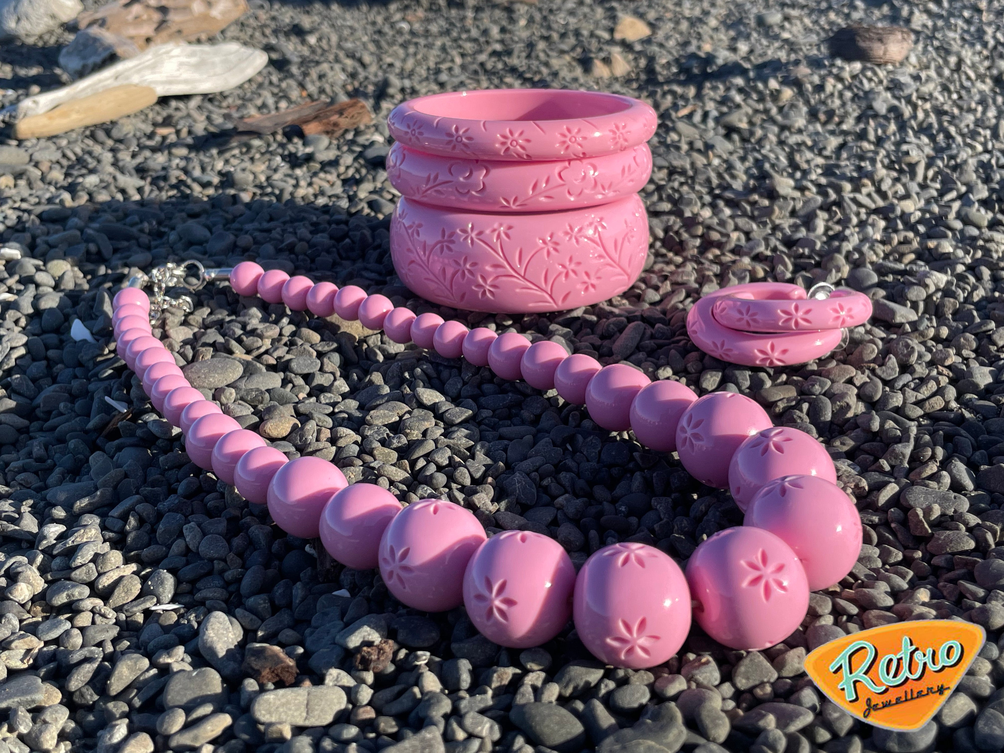 Narrow "Blossom" in baby pink by MCR carved fakelite bangle