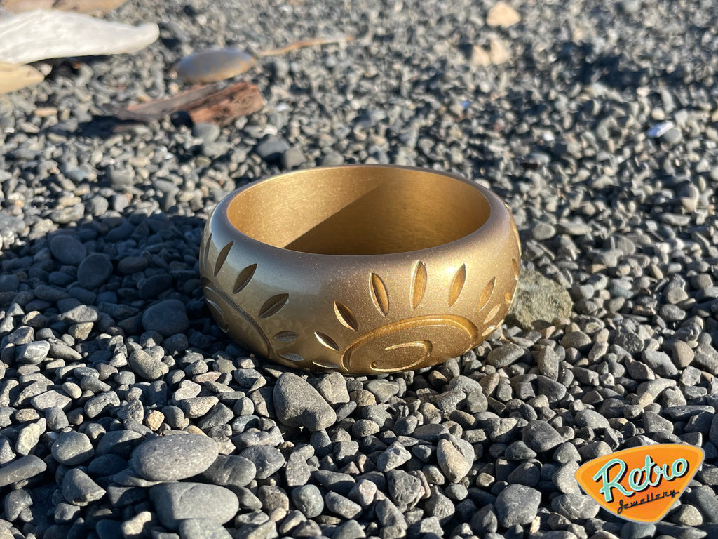 Golden sun by MCR wide carved fakelite bangle