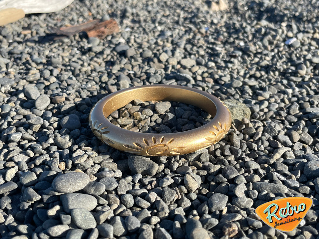 Golden sun by MCR narrow carved fakelite bangle