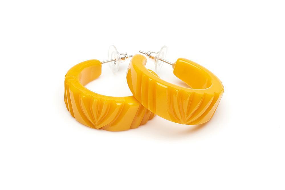 Yolk Heavy carved fakelite hoop earring