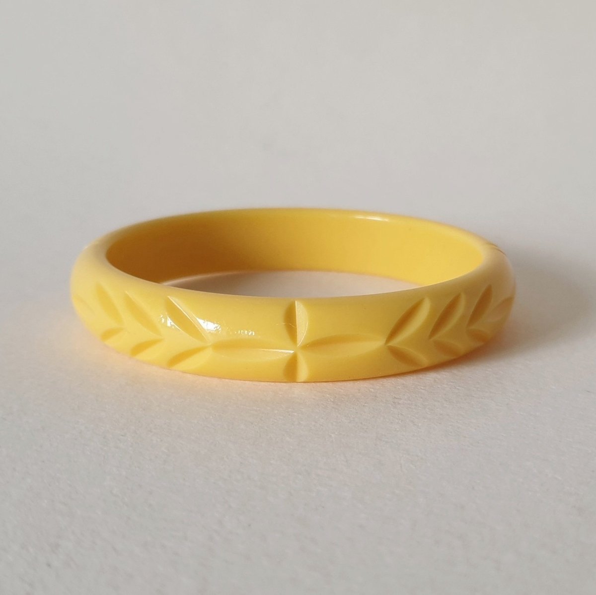 Elsie carved fakelite bangle -  Pale yellow