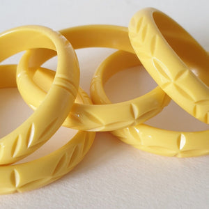 Elsie carved fakelite bangle -  Pale yellow
